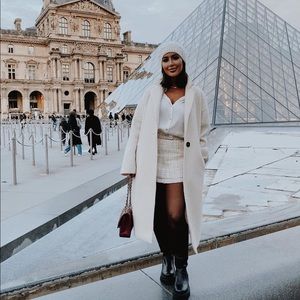 White coat with black buttons. Can include hat for $10 extra